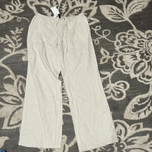 H & m divided crop pants. Size medium. NWT. Khaki and white striped. Pockets.